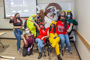 Eastern's student organization FEMALES dress is costumes for club event. 