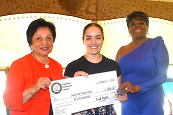 Eastern President Elsa Núñez, left, and NAACP President Leah Ralls, right, congratulate Adalyse Gonzales on winning an NAACP scholarship