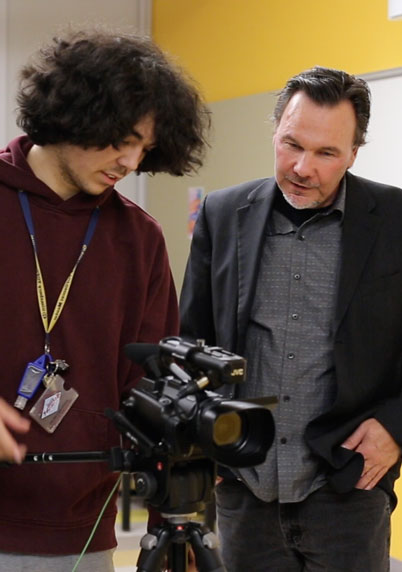 professor Brian Day and a student using a camera