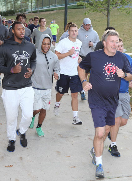 Professor and students running