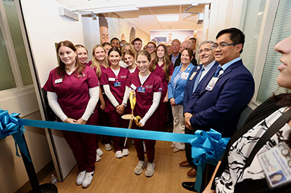Nursing students gather for ribbon cutting ceremony for nursing simulation lab in Windham Hospital