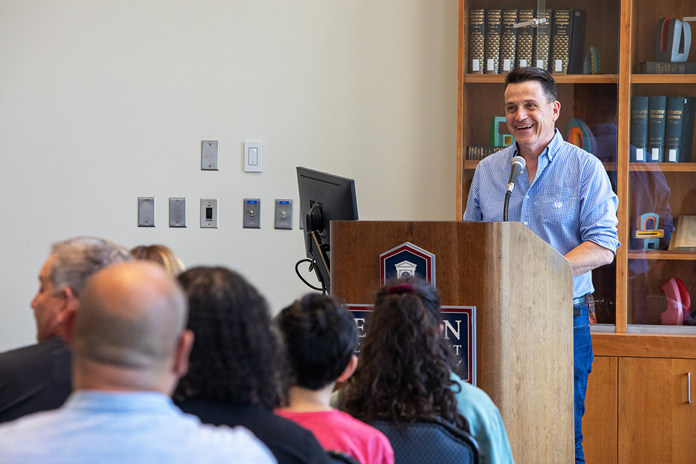 Donaghy engages with the audience at a campus event.