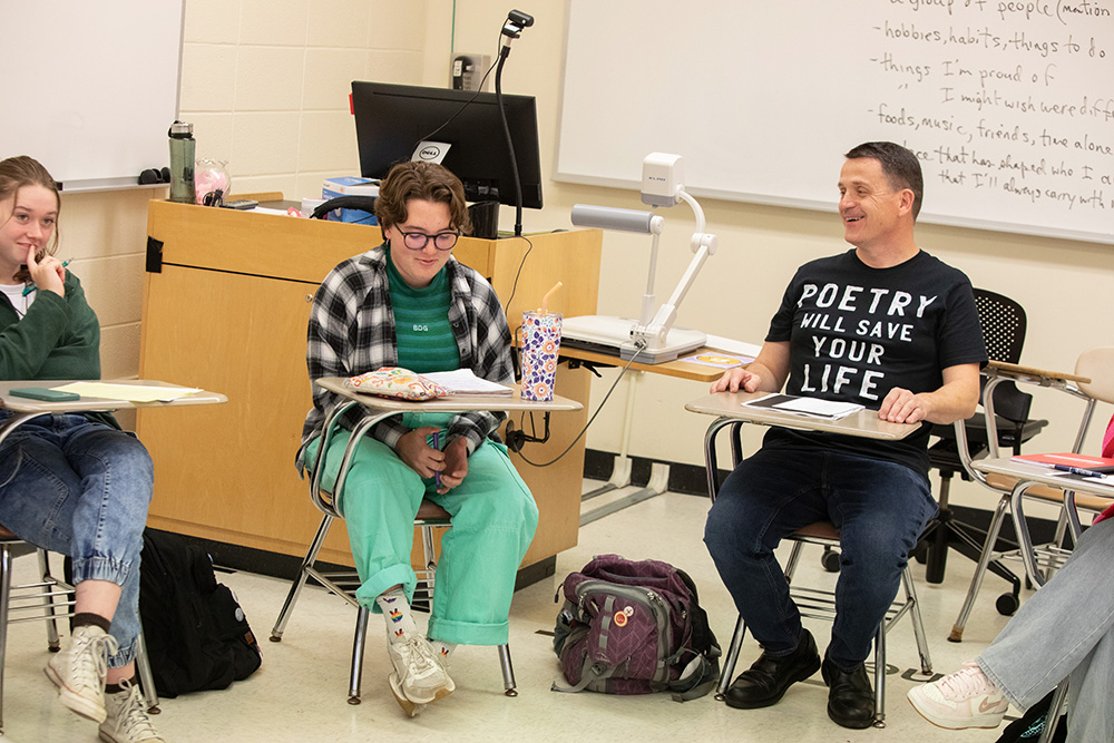 Donaghy works with students in one of his classes.