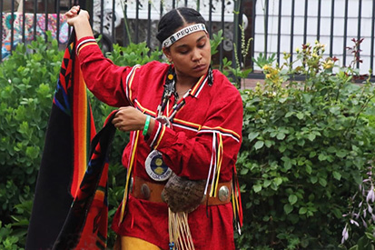 Natasha Gambrell '15 performs a traditional Eastern Pequot dance.