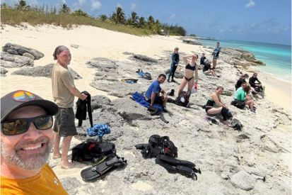 Professors Josh Idjadi (left) and Brett Mattingly (second from left) lead a beach study session in the Bahamas.