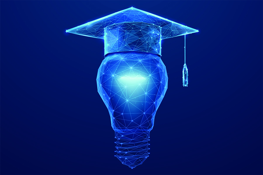A stock image depicting a light bulb wearing a graduate cap