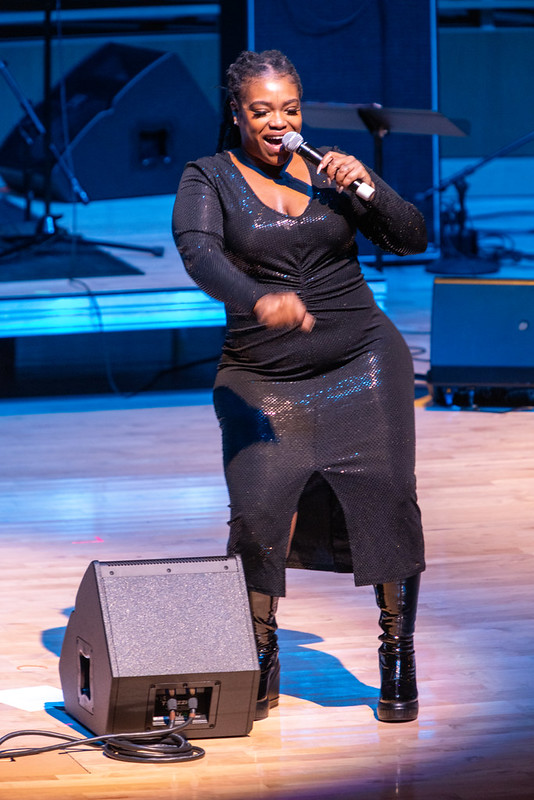 A singer onstage at "Take Me to the River All Stars"