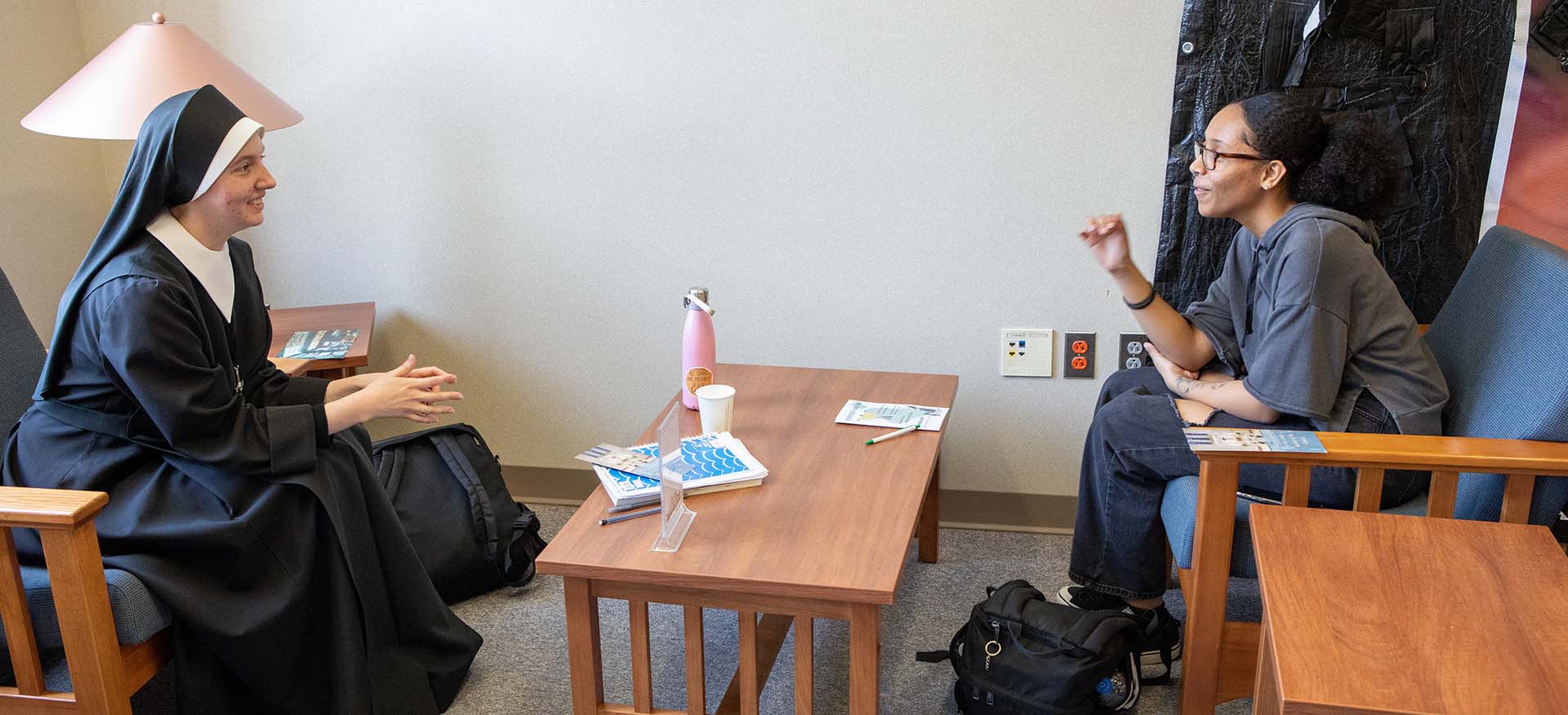 student and nun talking