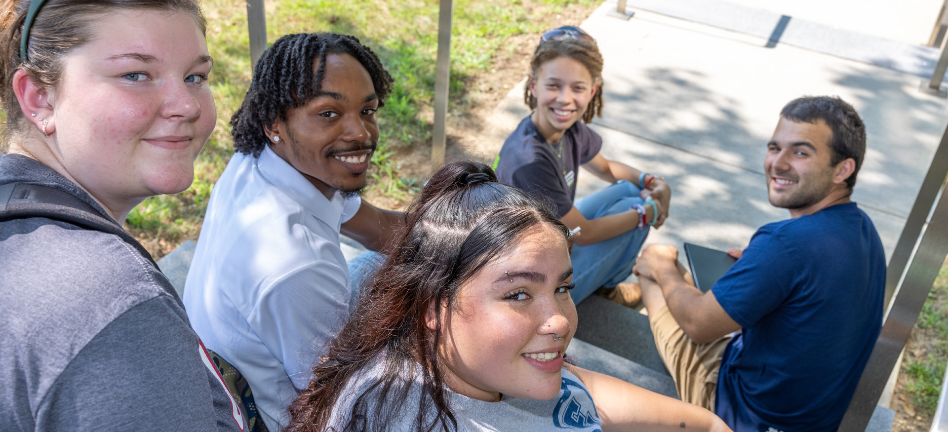 students sitting on stairs on Eastern's campus