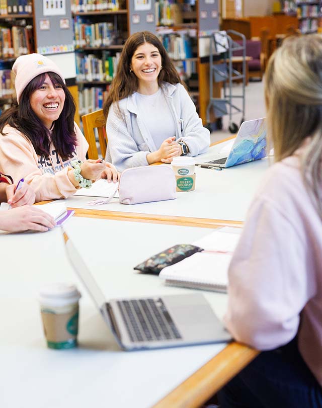 students hanging out in the library