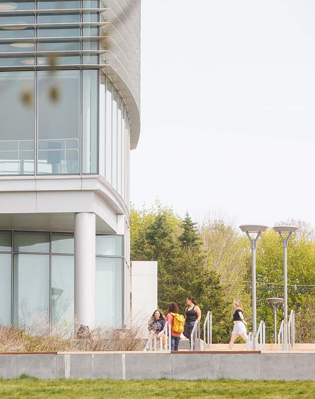 students walking outside of the Fine Arts Instructional Center