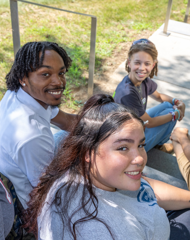 students sitting on stairs on Eastern's campus