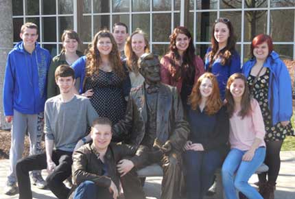 group of students posing with Lincoln statue
