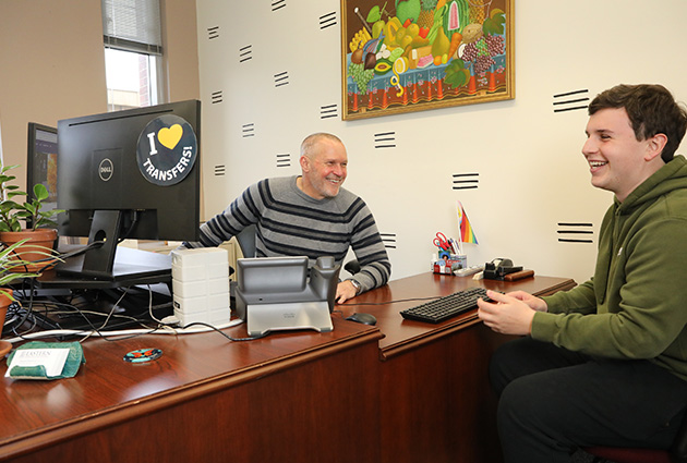 student and advisor laughing