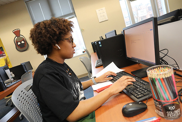 student working on computer
