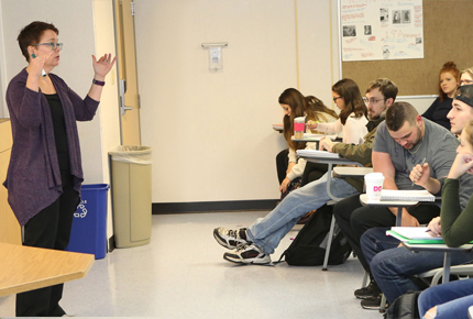 professor lecturing in front of class