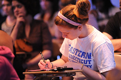 Decorative image of a student working at their desk