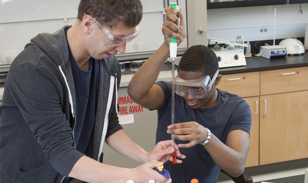 Students measuring liquids during undergraduate research