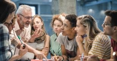 instructor leading a group of engaged college students 