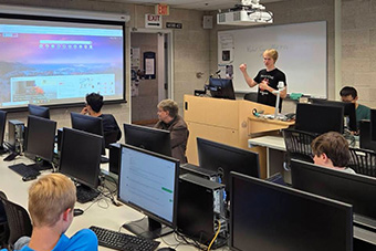  student talking in front of class 