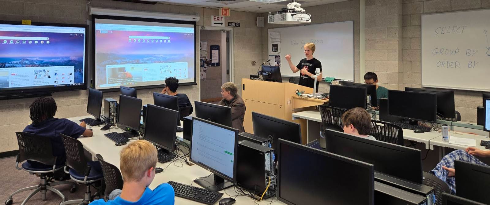 student talking in front of class