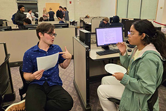  students performing mock interviews 