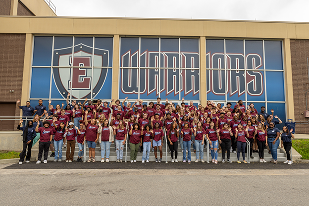 eastern students in front of the warriors banner