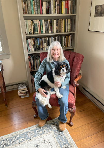 Susan Wilson sitting with her dog 