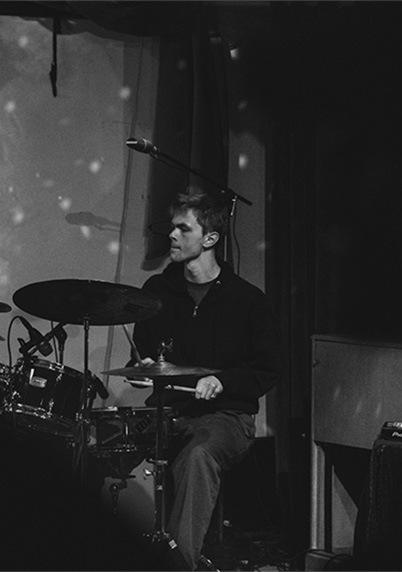 Evan Wood playing a drum set