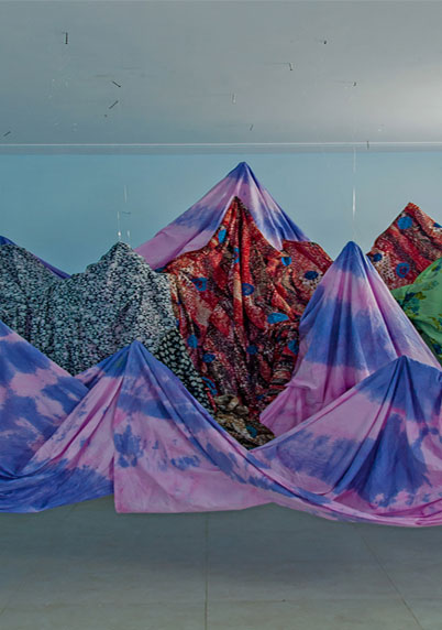 Leila Seyedzadeh, Pink Mountain, hand-dyed cotton cloth, found cloth, rope, fishing wire, 15 x 12 x 8 ft, 2017