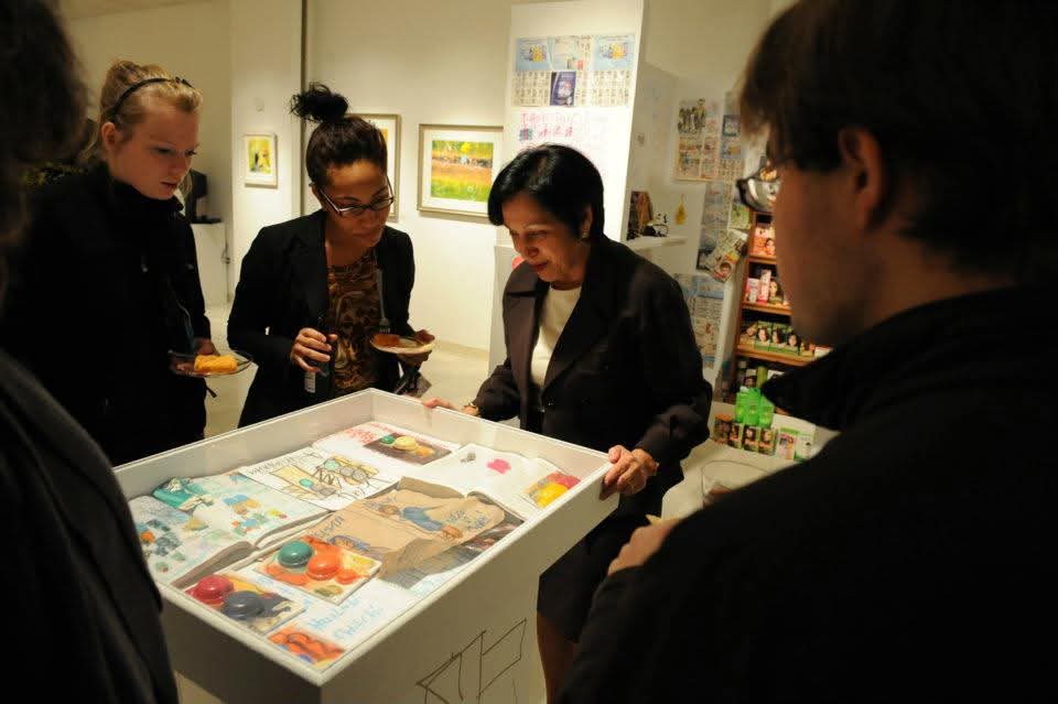 President Elsa Núñez enjoying the artwork in the Akus Gallery