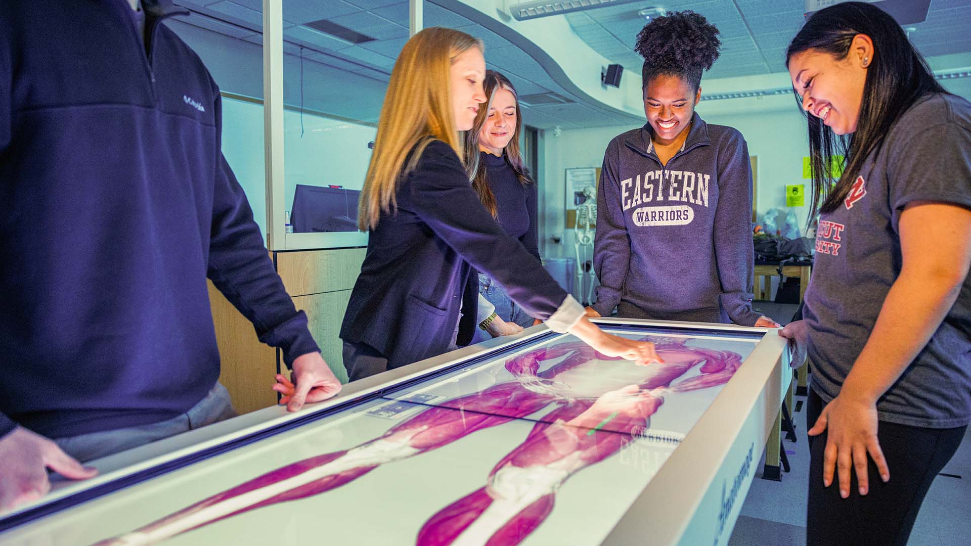 professor and students using virtual dissection table