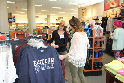 students looking at hoodies in the Eastern Bookstore