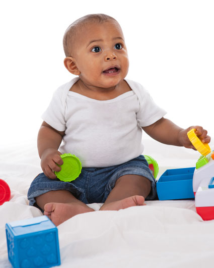 Infant seated with toys