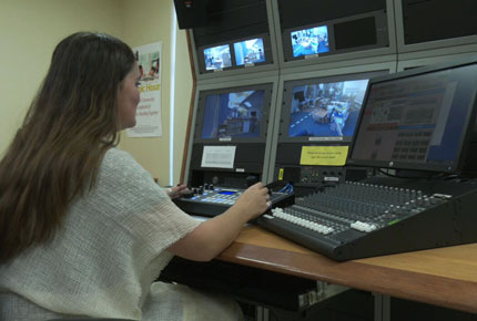 A student researcher records footage in the Center's master control room