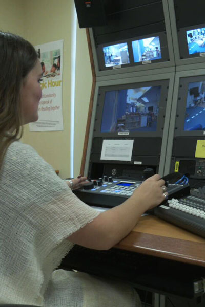  A student research assistant records video footage in the Center's master control room 