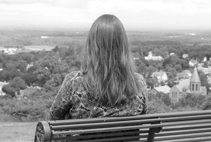  woman sitting on a bench 