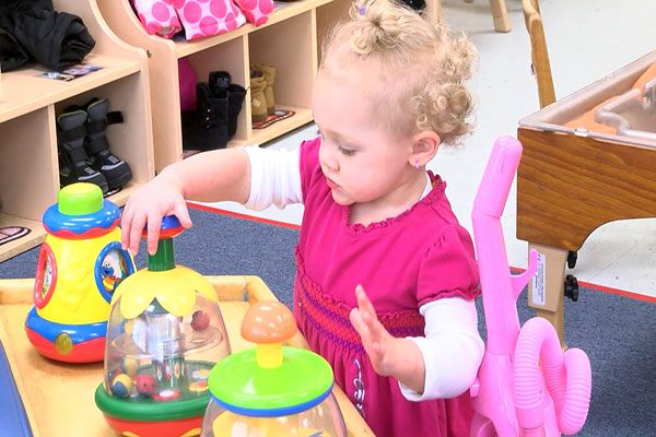 A toddler playing with toys