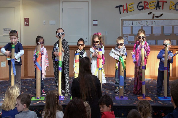 Image of children in costumes on a stage