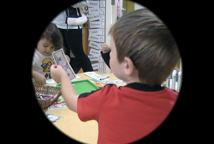 Image of a child holding money