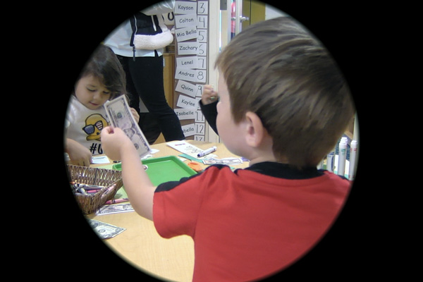 Image of a child holding money