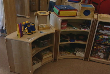 Shelves full of learning materials for preschoolers