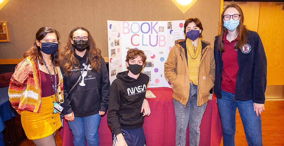 students posing for photo at club fair