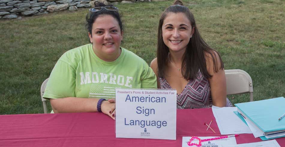 ASL Club student posing at club fair