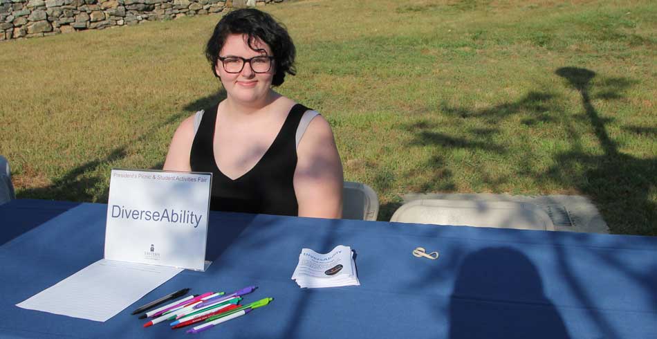 club member at recruitment booth