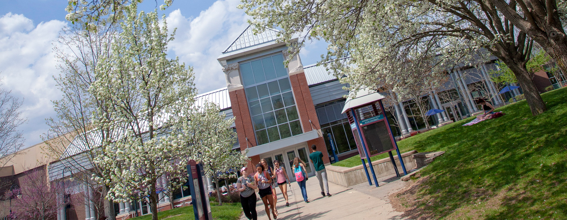 students walking in front of the student center