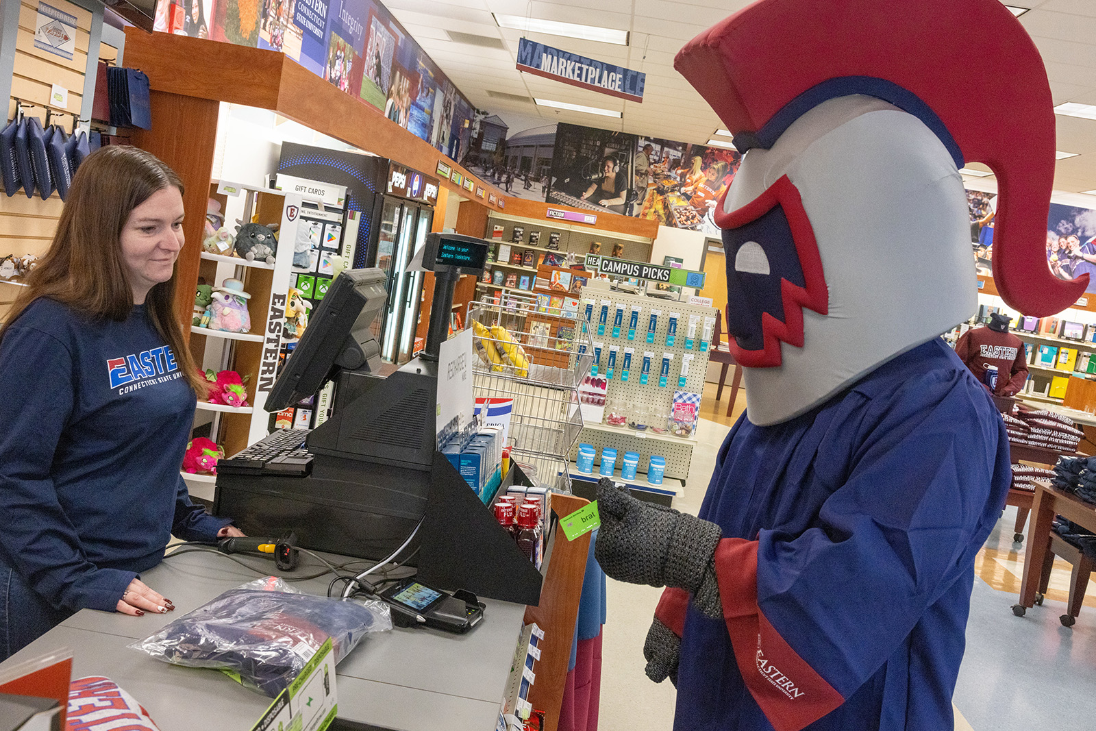 Willi the Warrior purchasing a gown from the bookstore