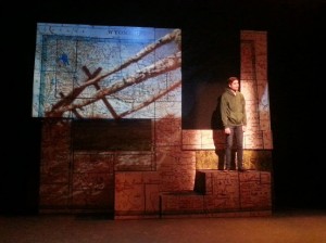 student actor performing on stage standing on a platform