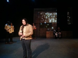 student actor performing with other student actors in the background