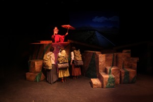 student actors interacting with a puppet